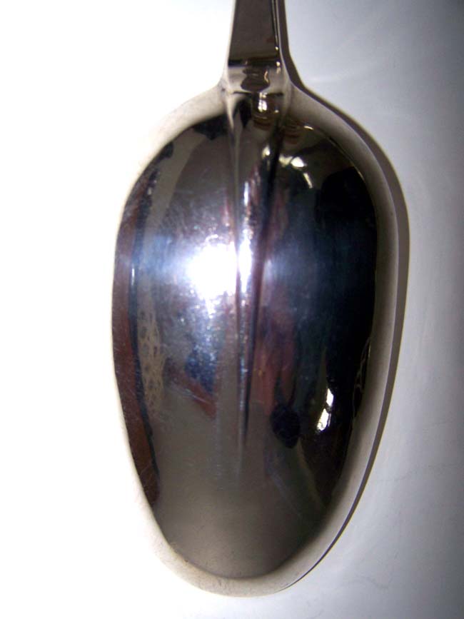 An English Queen Anne Period Silver Basting Spoon made in London in 1712 having a crest depicting a Bat. — image 3